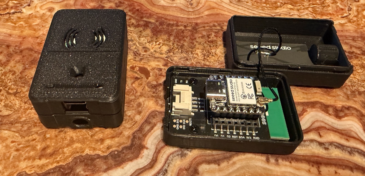The MR60BHA2 XIAO case opened into three parts, exposing the inner USB-C data/flash port and the 60 GHz radar module